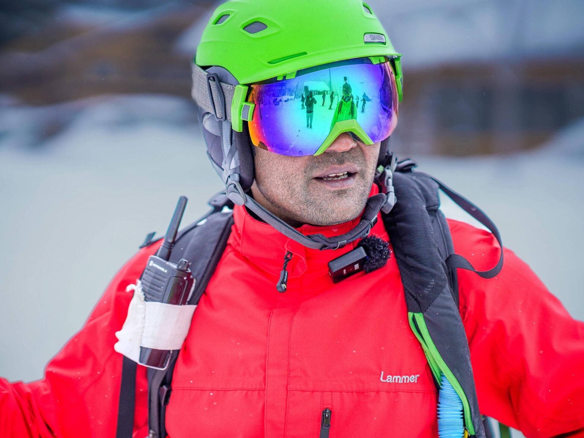 Ski goggles and walkie talkie in snow